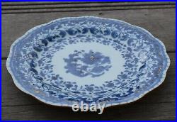 A antique chinese blue and white dish with molded rim period of Qianlong