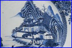 A big antique Chinese blue & white charger with landscape scene, Qianlong period
