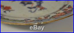 A pair of 18th century Chinese blue and white clobbered octagonal plates