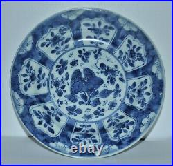 An elegant Chinese circa 1700 Kangxi period blue and white plate signed bottom