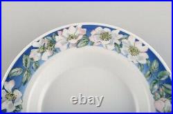 Four Royal Copenhagen White Rose deep plates with blue border, white flowers