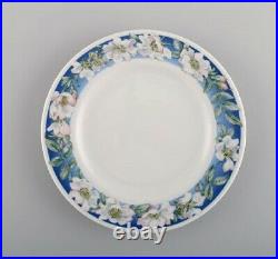 Four Royal Copenhagen White Rose plates with blue border, white flowers