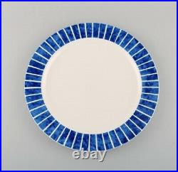 Jackie Lynd for Duka. Eight plates in glazed stoneware with blue stripes