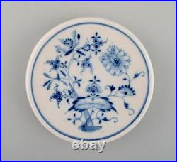Stadt Meissen Blue Onion pattern. Trivet and three plates. Mid-20th century